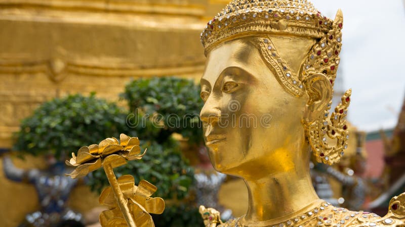 Beautiful face golden angel statue Thailand. The face golden angel statue of Temple of the Emerald Buddha (Wat pra kaew) and Grand palace ,Bangkok,Thailand royalty free stock image Beautiful face golden angel statue Thailand. The face golden angel statue of Temple of the Emerald Buddha (Wat pra kaew) and Grand palace ,Bangkok,Thailand royalty free stock image