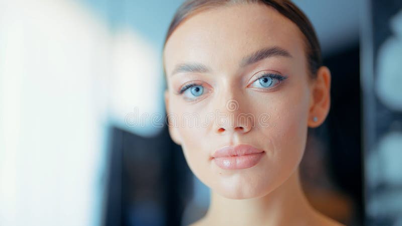 Beautiful Face Of Tender Attractive Brunette Woman With Blue Eyes
