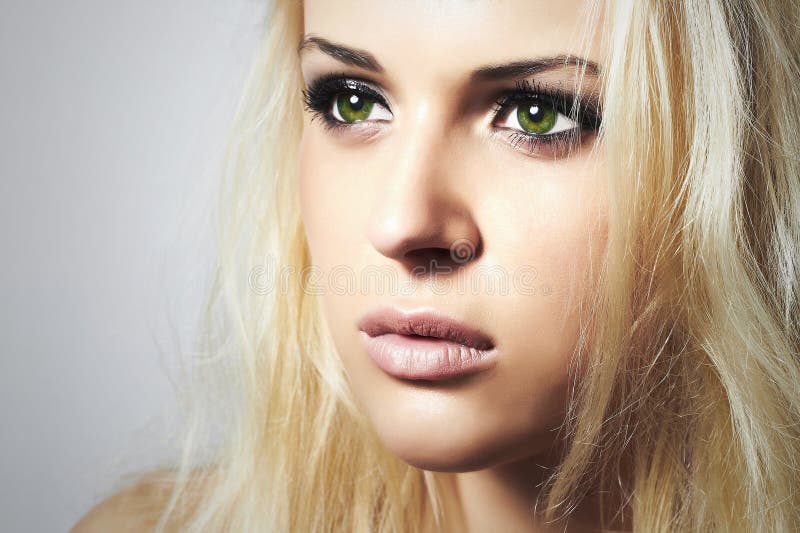 Beautiful Face of Young Woman.Blond girl.sad woman with green eyes