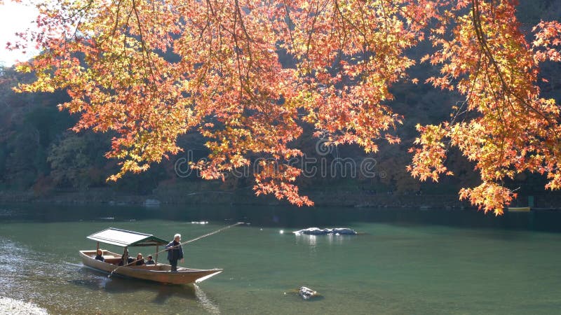 Beautiful fall color and Katsura River with boat