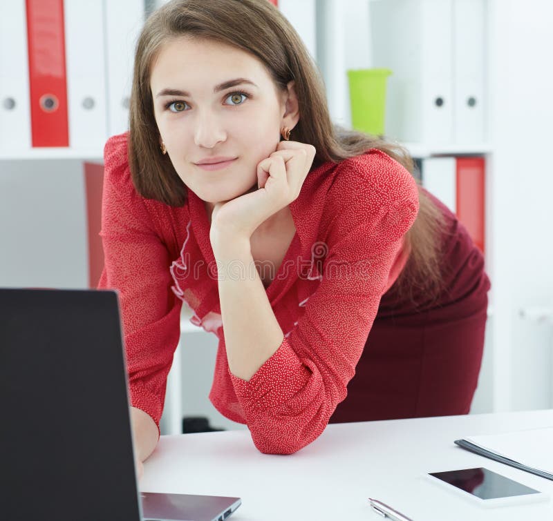 Young Smiling Caucasian Secretary with Female Colleague on the Young Smiling Caucasian Secretary with Female Colleague on the