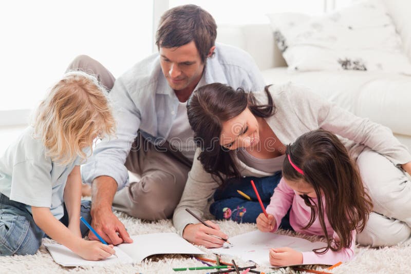 Beautiful family drawing together stock photos