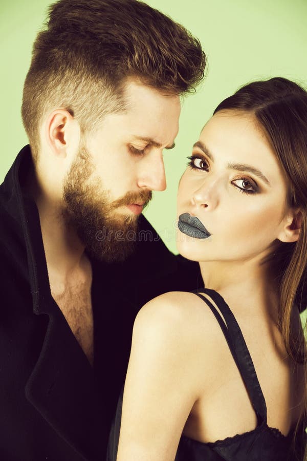 Beautiful fashion couple in love on green background stock images Beautiful fashion couple in love on green background stock images