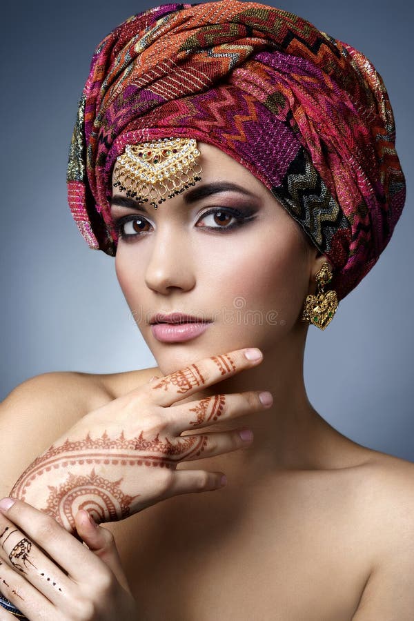 Beautiful fashion east woman portrait with oriental accessories royalty free stock image Beautiful fashion east woman portrait with oriental accessories royalty free stock image