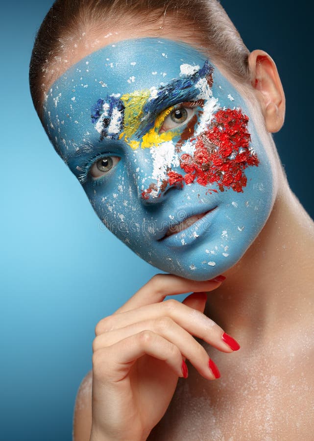 Beautiful fashion model with face art in winter style. royalty free stock photography Beautiful fashion model with face art in winter style. royalty free stock photography