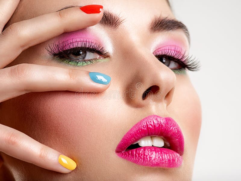 Beautiful fashion woman with a colored nails. Attractive white girl with multicolor manicure royalty free stock photo Beautiful fashion woman with a colored nails. Attractive white girl with multicolor manicure royalty free stock photo