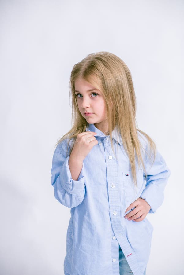 Beautiful Fashionable Little Girl with Blond Hair in Jeans Clothes on a ...