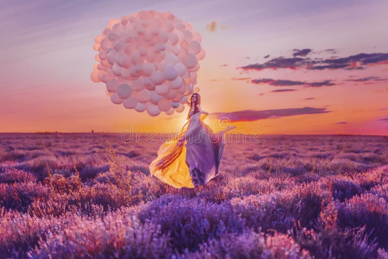 Beautiful female with balloons in lavender stock photo Beautiful female with balloons in lavender stock photo