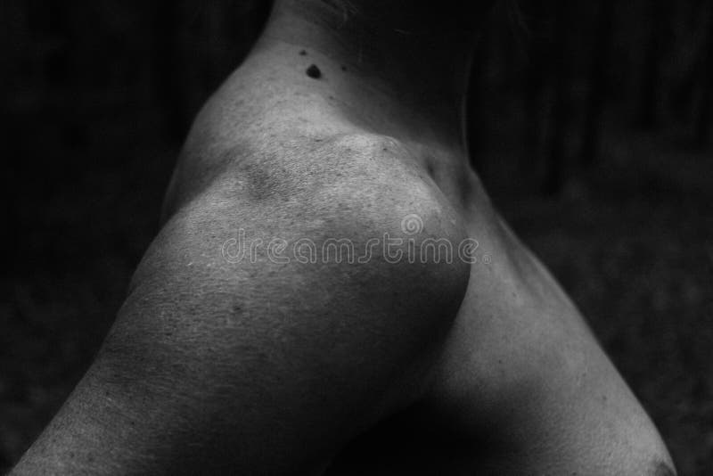 Beautiful female clavicle shoulder neck black and white photo, embossed athletic body, natural light. close-up, details of skin features, freckles. Beautiful female clavicle shoulder neck black and white photo, embossed athletic body, natural light. close-up, details of skin features, freckles