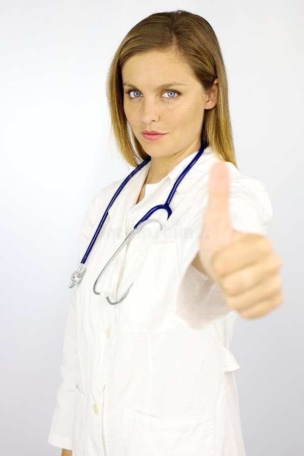 Beautiful female doctor thumb up serious.