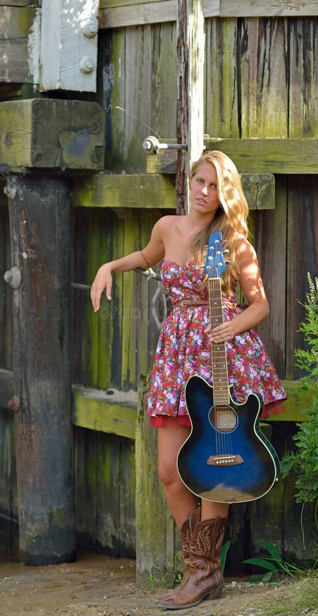 Beautiful Female Guitar Player Outdoors Stock Image -4491