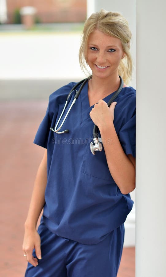 Beautiful Blonde Woman in Blue Scrubs - Pills Stock Photo - Image of ...