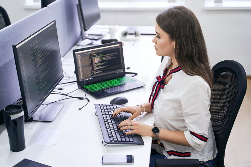 Beautiful Female Junior Software Developer Working on Computer in it  Office, Sitting at Desk and Coding, Working on a Stock Image - Image of  developer, commitment: 187002775