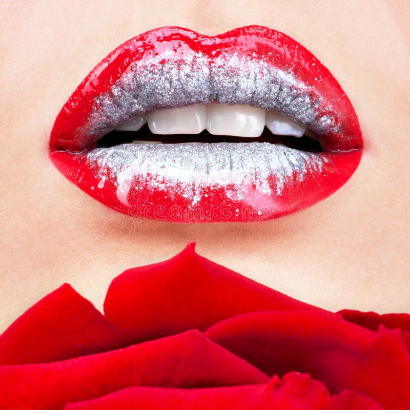 Beautiful female lips with shiny lipstick and red rose stock photography Beautiful female lips with shiny lipstick and red rose stock photography