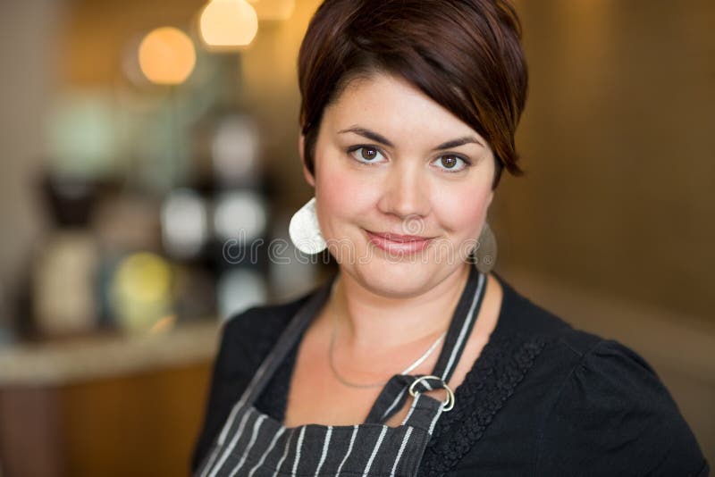 Beautiful Female Owner in Cafe royalty free stock photo Beautiful Female Owner in Cafe royalty free stock photo