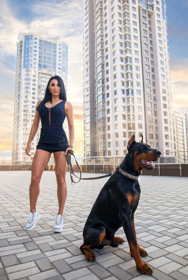 Fitness Girl Walking with Huge Doberman Dog Stock Photo - Image of city,  fashion: 164656974