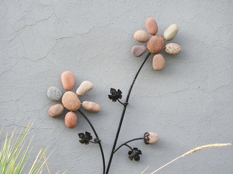 Flowers made from stone on home wall, Lithuania stock image Flowers made from stone on home wall, Lithuania stock image