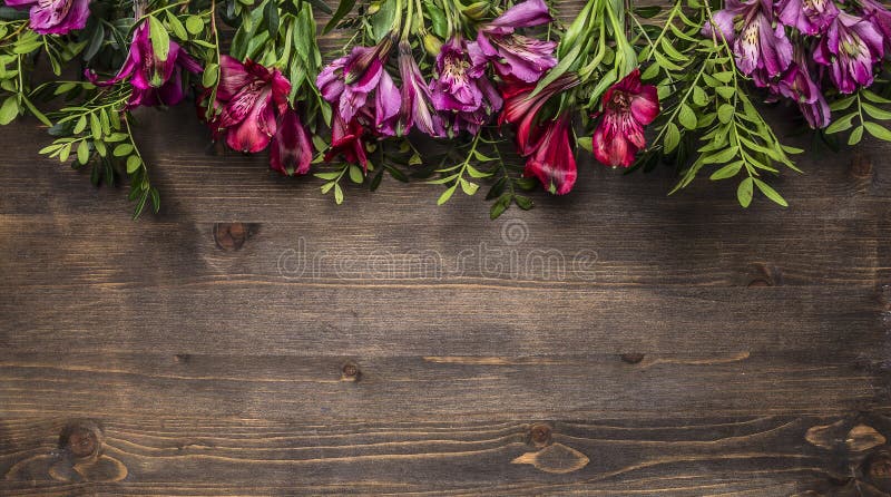 Beautiful freesya multicolored flowers with green leaves border ,place for text wooden rustic background top view royalty free stock photo Beautiful freesya multicolored flowers with green leaves border ,place for text wooden rustic background top view royalty free stock photo