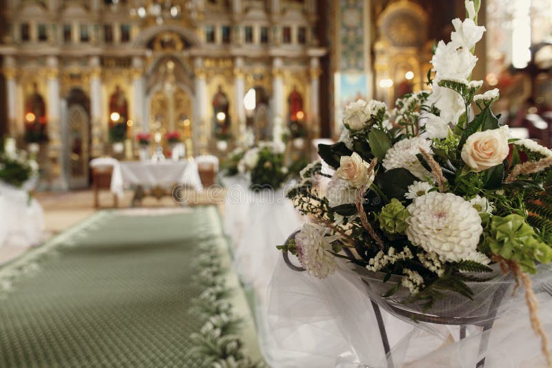 Beautiful fresh white flowers bouquet decoration for wedding ceremony in christian orthodox church, interior closeup royalty free stock images Beautiful fresh white flowers bouquet decoration for wedding ceremony in christian orthodox church, interior closeup royalty free stock images