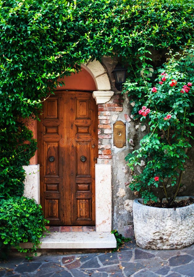 Beautiful Garden with Old Antique Door, Flowers and Ivy. Vintage Stock ...