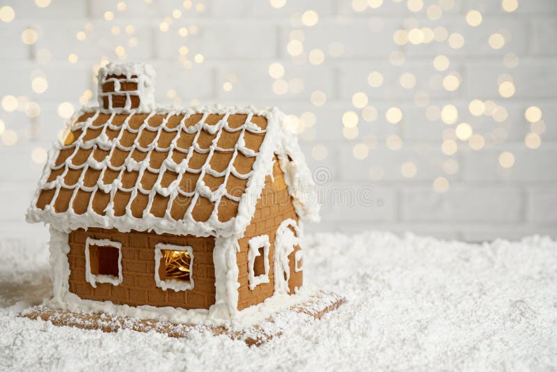 Beautiful Gingerbread House Decorated with Icing on Snow, Space for