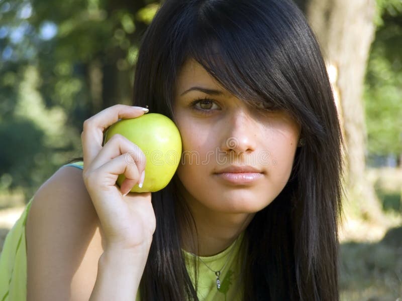 Beautiful girl with apple