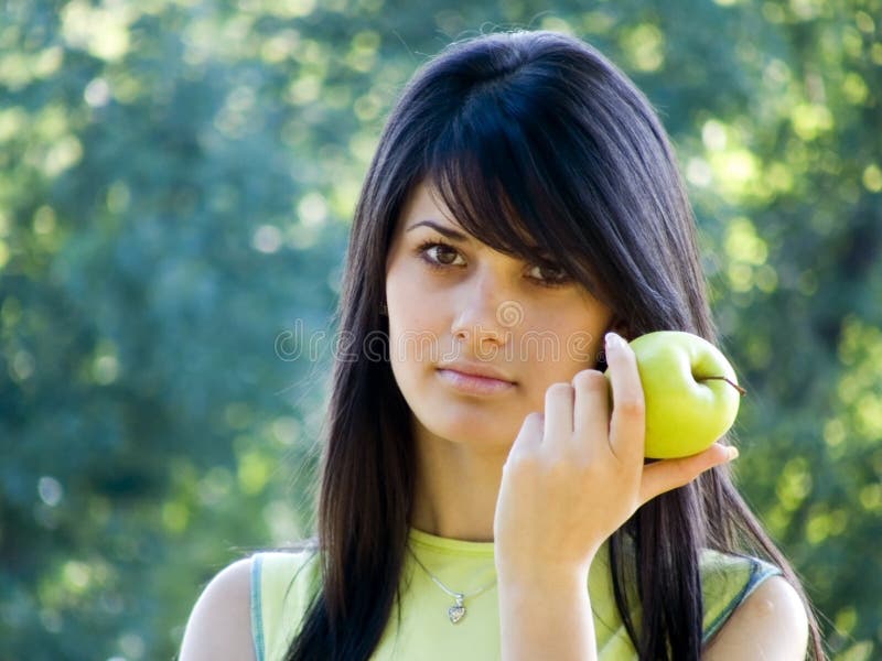 Beautiful girl with apple