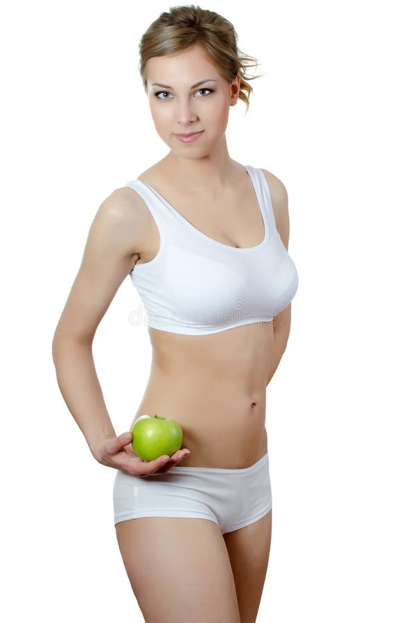 The beautiful girl with an apple in a hand stock images The beautiful girl with an apple in a hand stock images