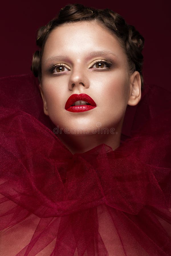 Beautiful girl with art creative make-up in image of red bride for Halloween. Beauty face. stock image Beautiful girl with art creative make-up in image of red bride for Halloween. Beauty face. stock image