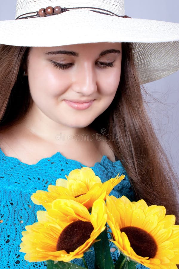 Beautiful Girl in a Beach Hat. Stock Image Image of closeup, candid