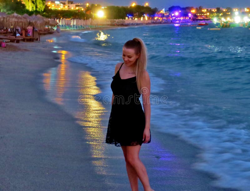 Beautiful girl in a black dress by the sea royalty free stock image Beautiful girl in a black dress by the sea royalty free stock image