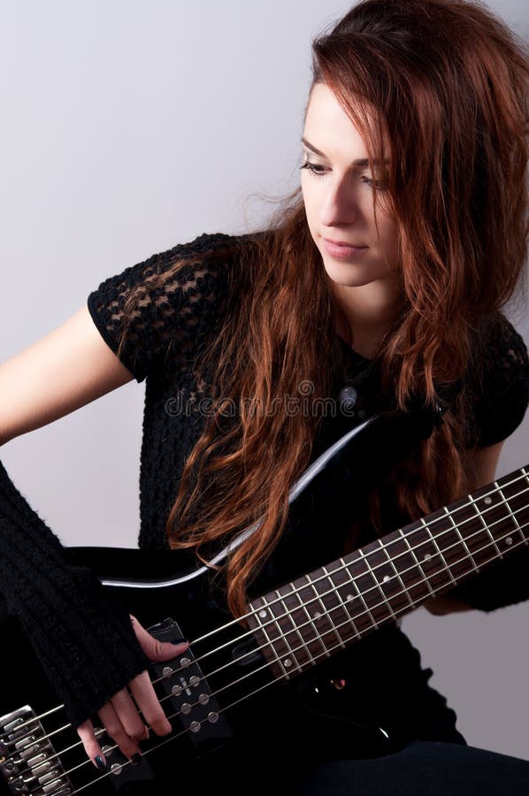 Beautiful Girl Playing Bass Guitar Stock Photo - Image of beauty, black:  34343706
