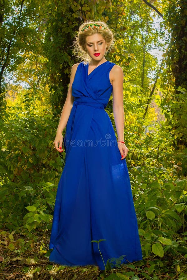 Beautiful Girl in a Blue Dress Posing in Forest Stock Image - Image of ...