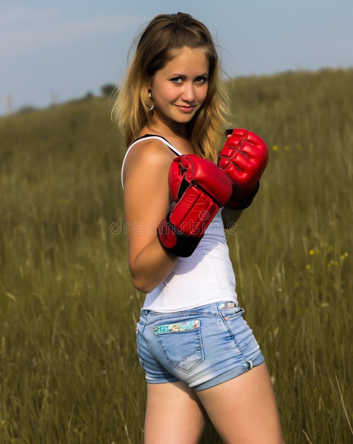 Beautiful girl in boxing gloves stock photos Beautiful girl in boxing gloves stock photos