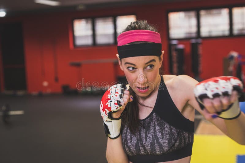 Beautiful girl boxing in the gym