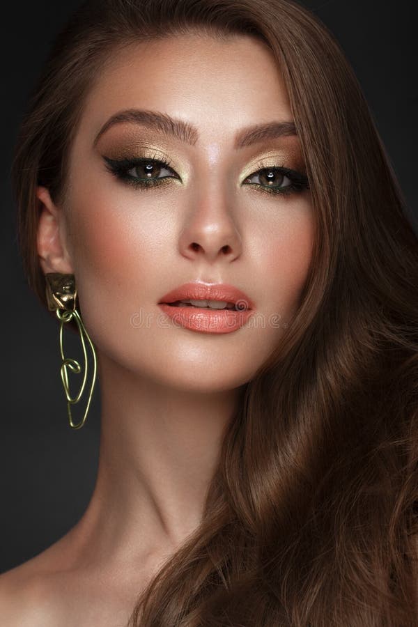 Beautiful Girl with Bright Fashionable Make-up and Unusual Gold ...