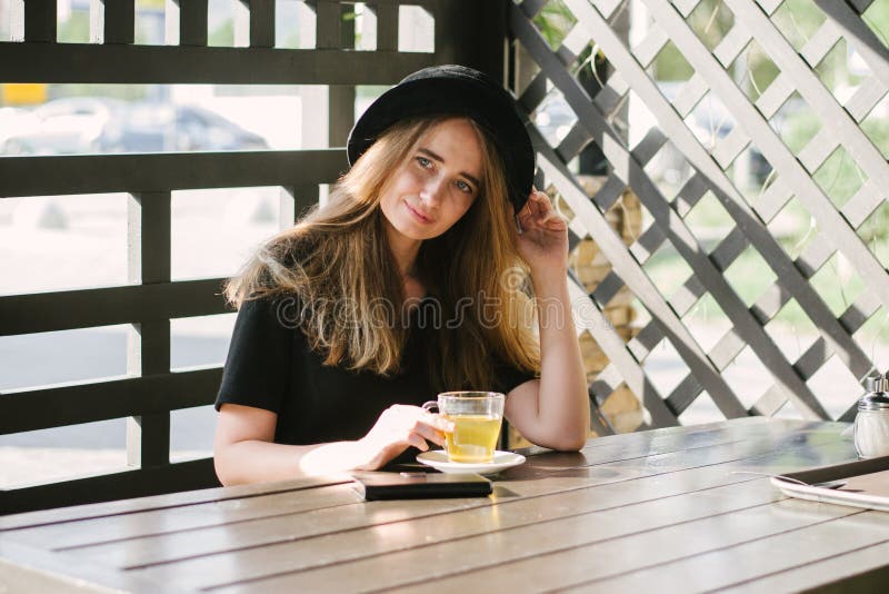 Beautiful girl in a cafe stock photos Beautiful girl in a cafe stock photos