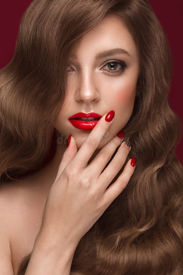 Beautiful Girl With A Classic Makeup Curls Hair And Red Nails 