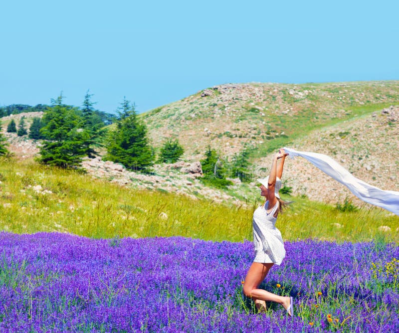 Beautiful girl dancing on lavender field