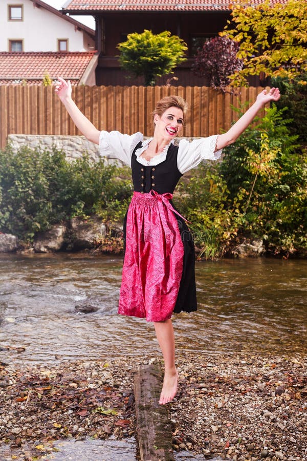 Beautiful Girl in a Dirndl Posing at a Stream Stock Photo - Image of ...