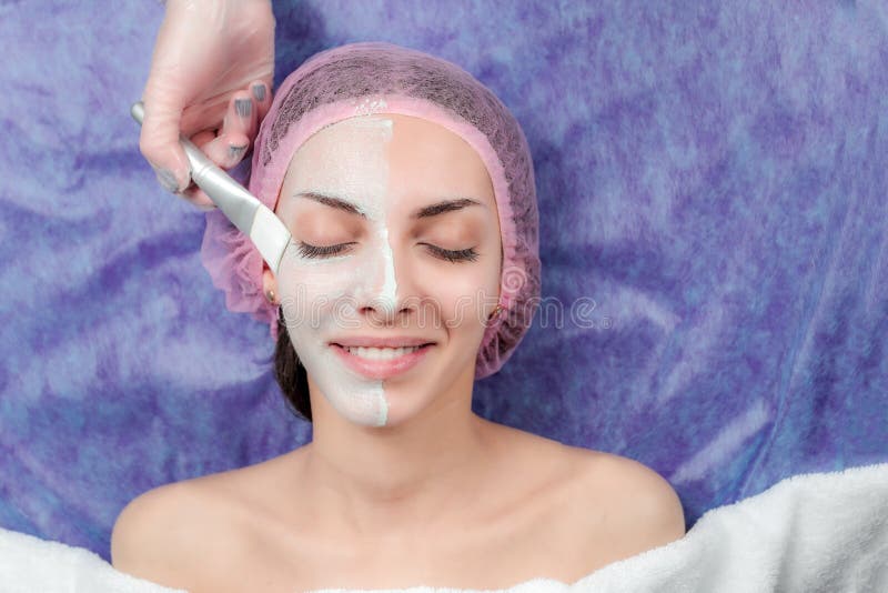 Beautiful Girl with facial mask at beauty salon royalty free stock photo Beautiful Girl with facial mask at beauty salon royalty free stock photo