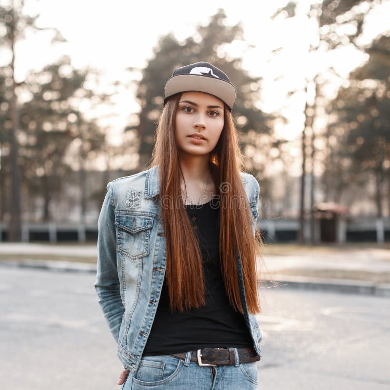 Beautiful Girl in the Fashion Denim Clothes on a Sunset Background ...