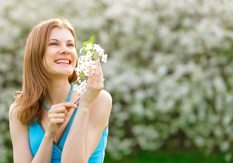 Beautiful girl with a flower outdoors