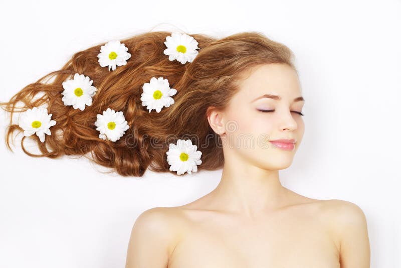 Smiling Woman with Flowers in Hair Stock Photo - Image of face, smile ...