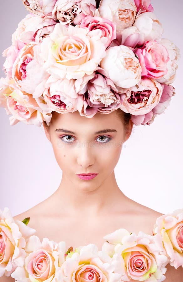 Beautiful Girl with Flowers Hair, Makeup and Silk Skin,looking at ...