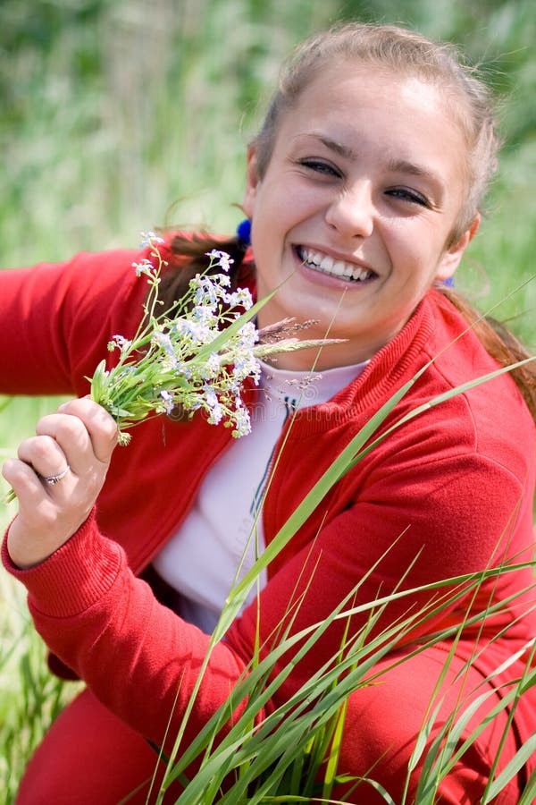 Beautiful girl gathering flowers. 1