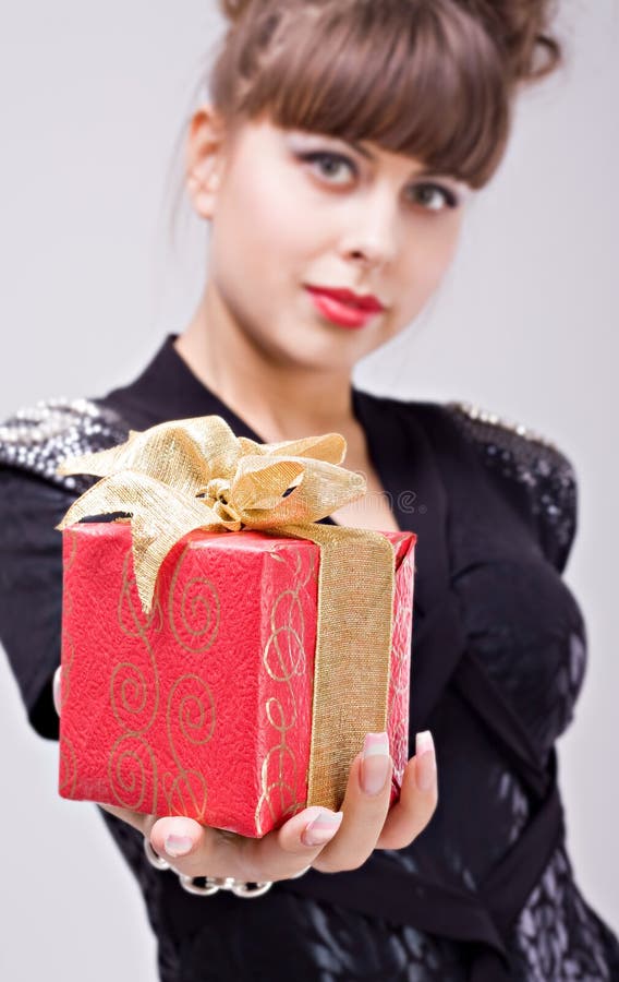 Beautiful girl with gift box