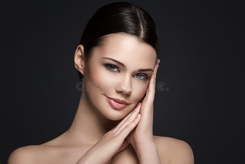 Beautiful girl on a gray background