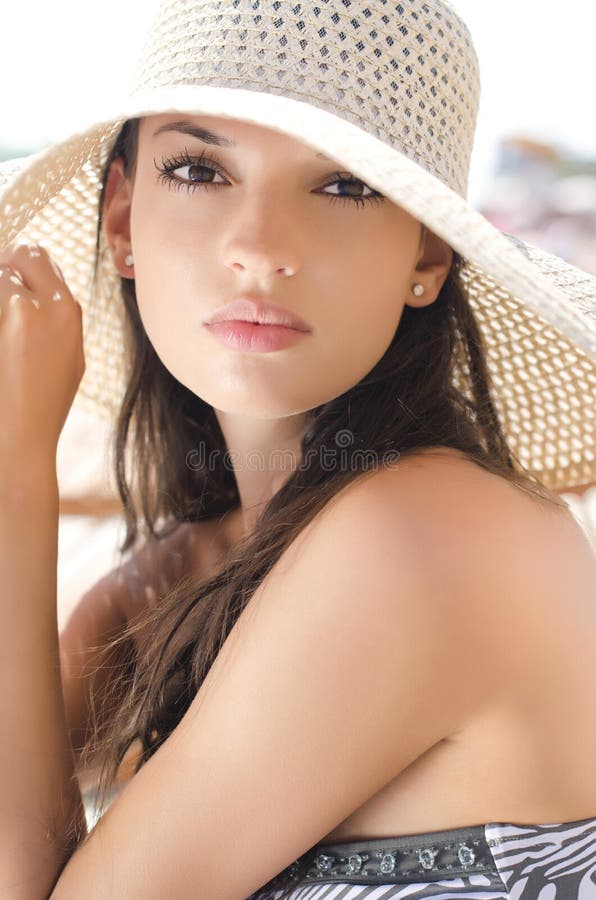 Beautiful girl with hat at the beach. royalty free stock photography Beautiful girl with hat at the beach. royalty free stock photography