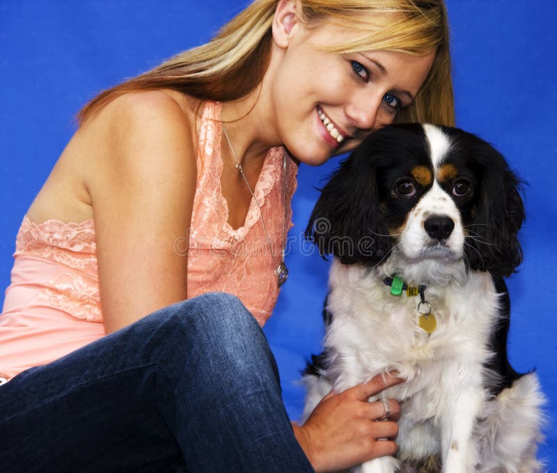 Beautiful girl with her Cavalier Spaniel